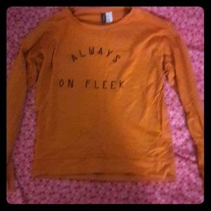 long sleeved orange h&m shirt